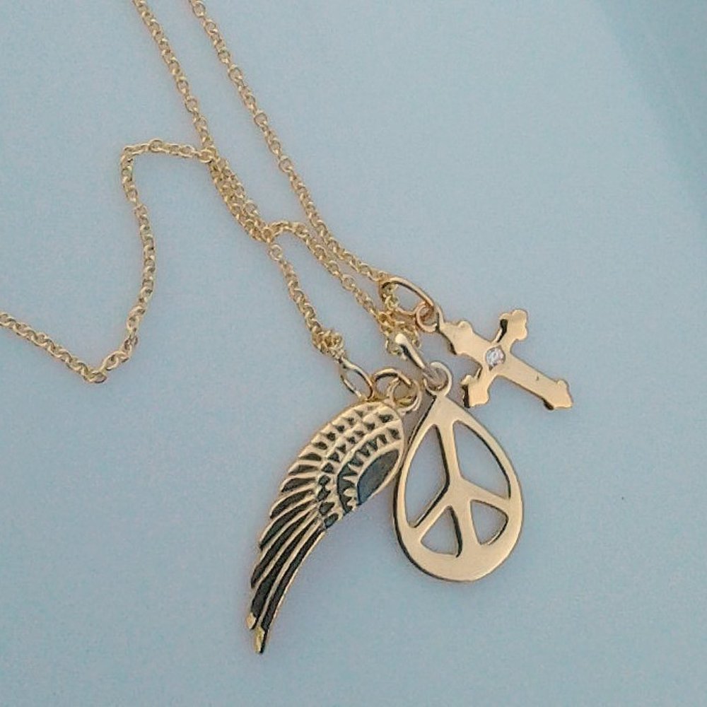 PEACE SYMBOL CROSS AND ANGEL NECKLACE